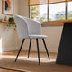 Silla Jade en pana gris claro con base negra y detalle de rombos, vista en perspectiva en un ambiente luminoso.